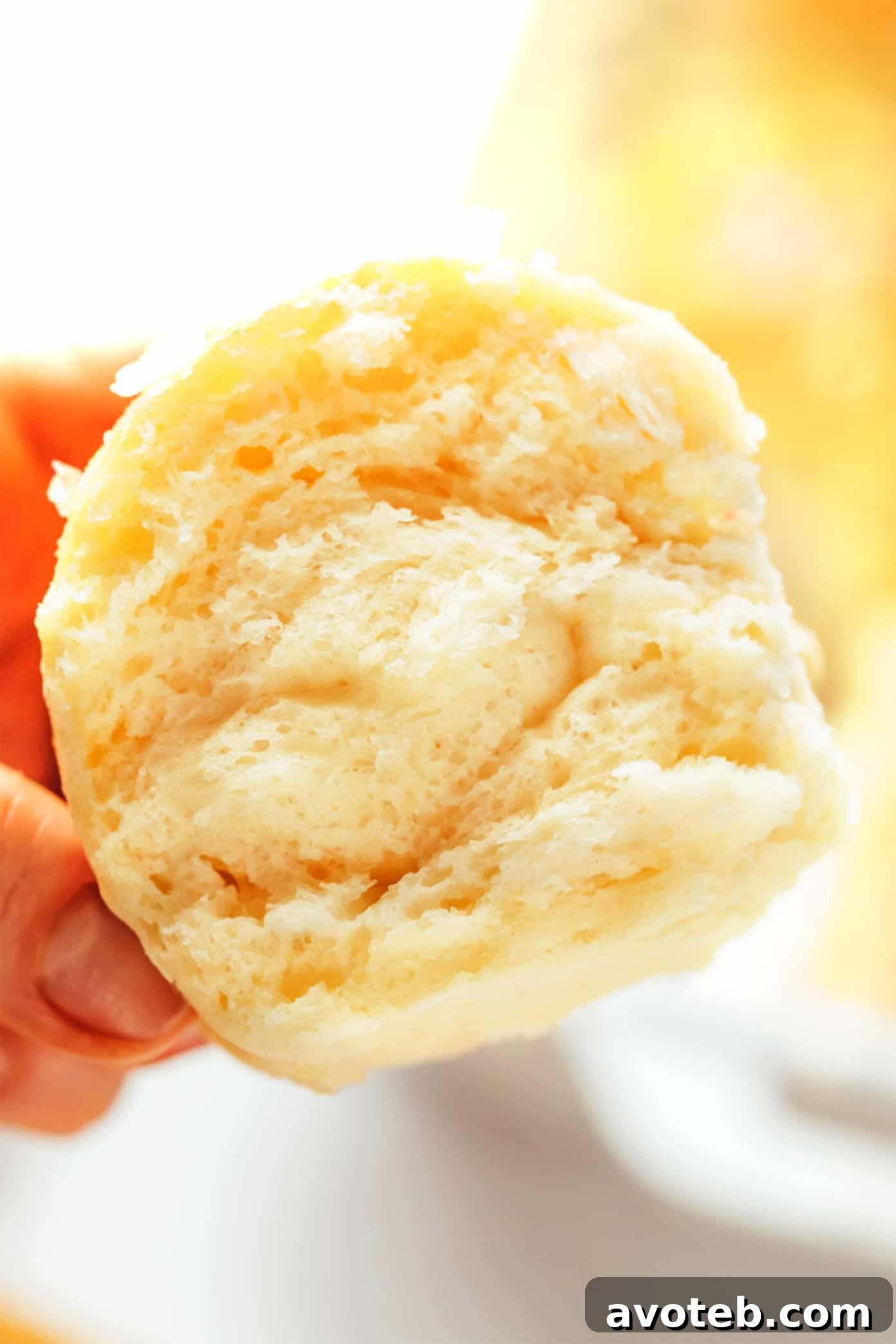 Close-up of a cottage cheese dinner roll showing its fluffy texture