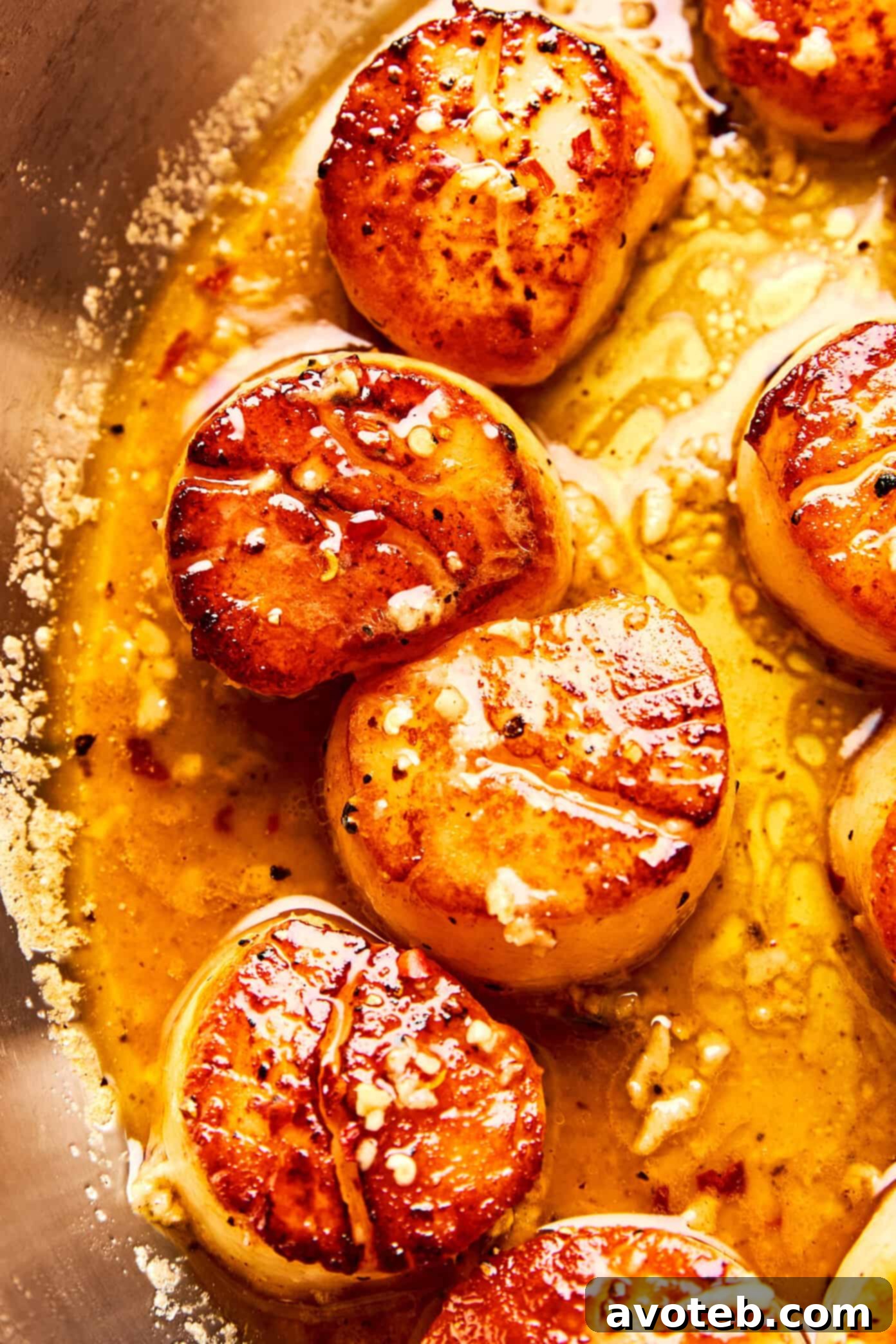 Lemon-Kissed Scallops with Garlic Butter Glaze 7 Close-up of beautifully seared scallops.