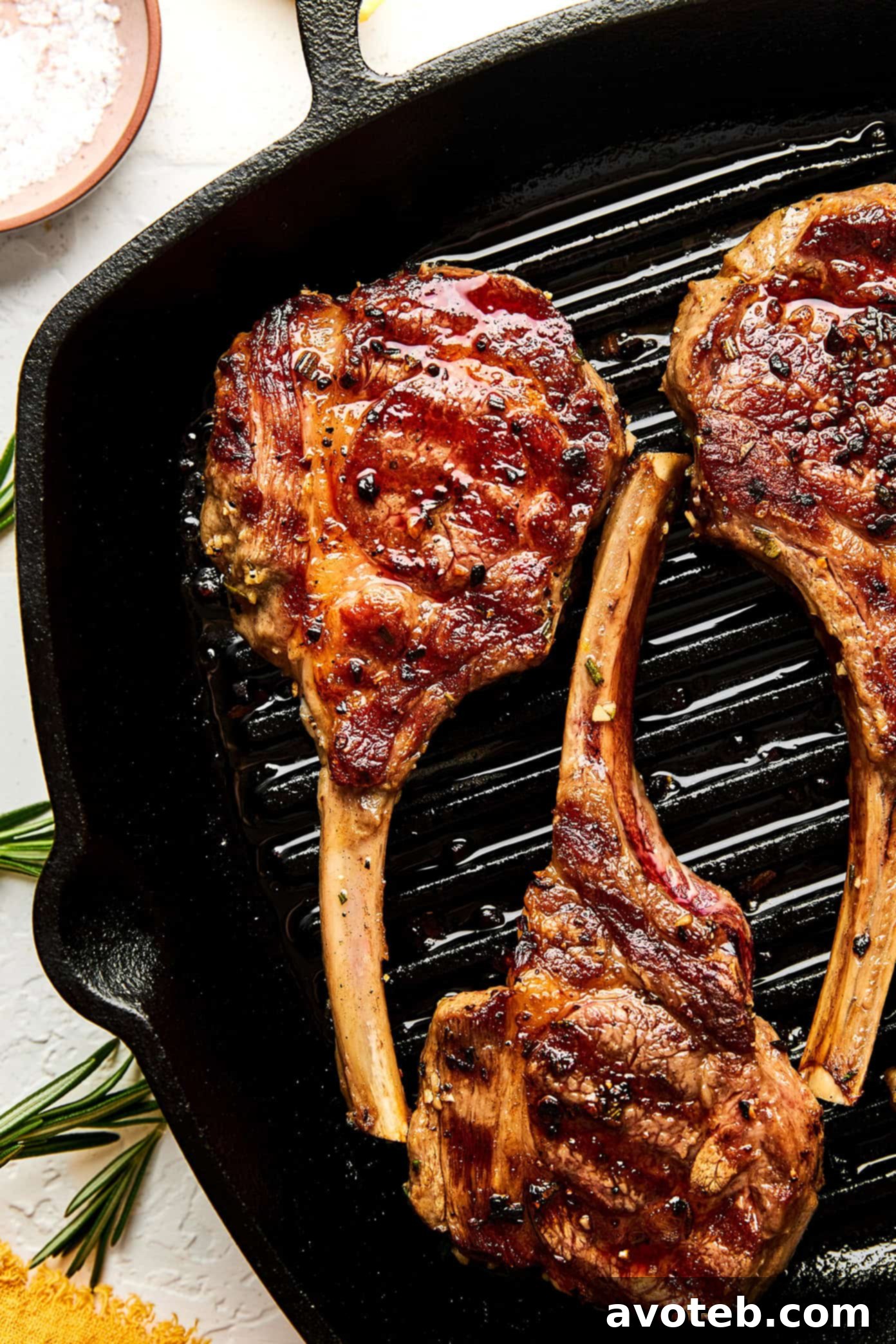 Plated garlic rosemary lamb chops with lemon butter