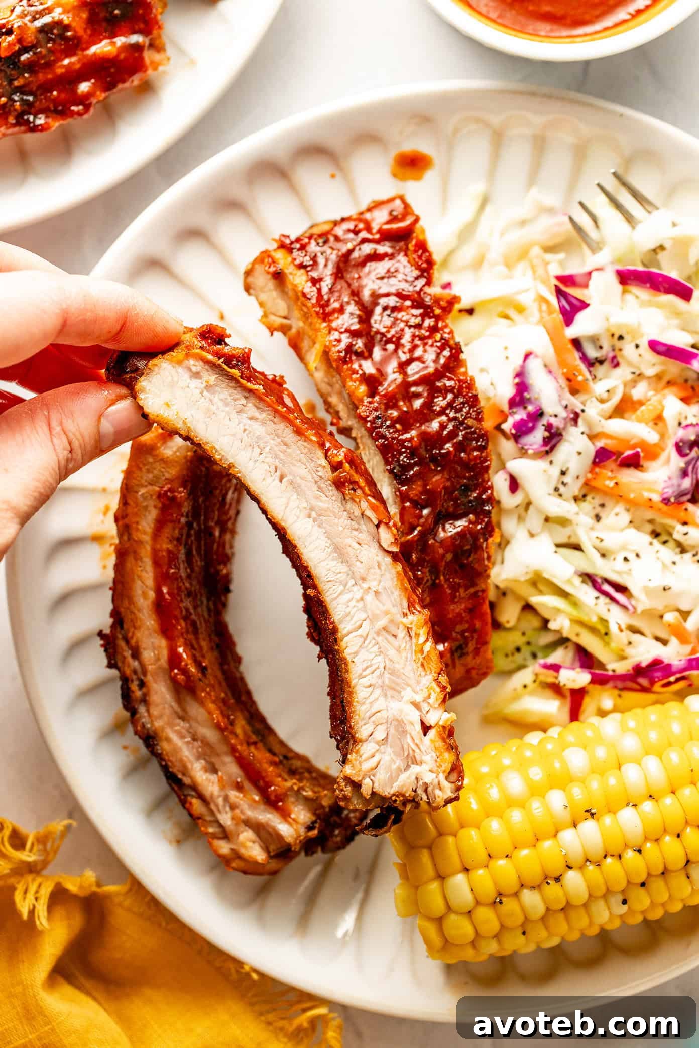 oven roasted baby back ribs with cole slaw and corn on the cob
