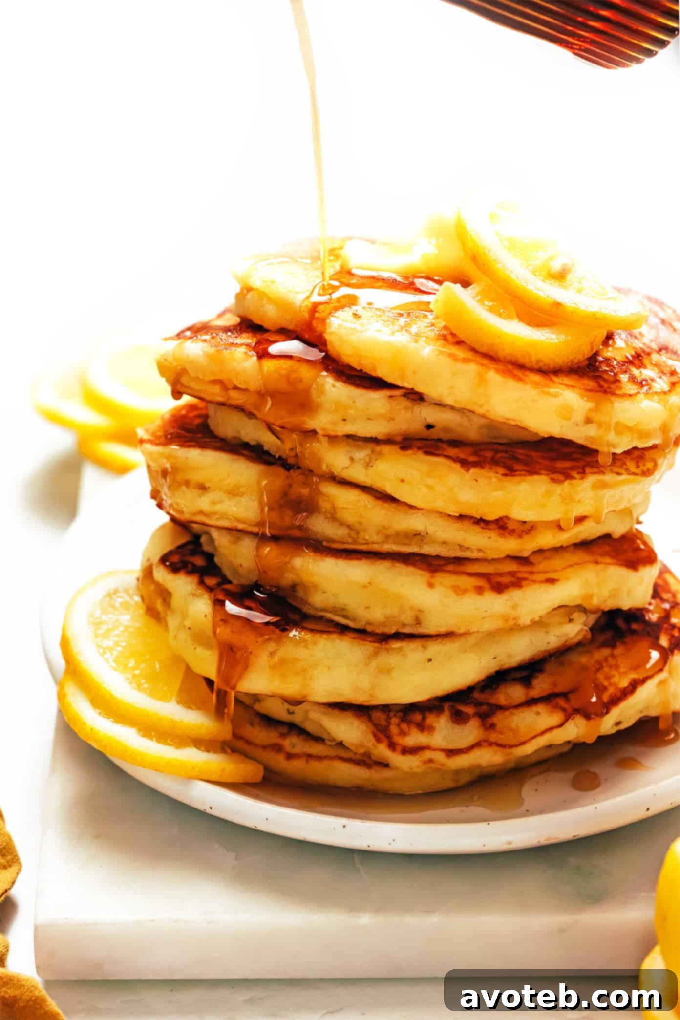 A finished stack of lemon ricotta pancakes on a plate, ready to be served.